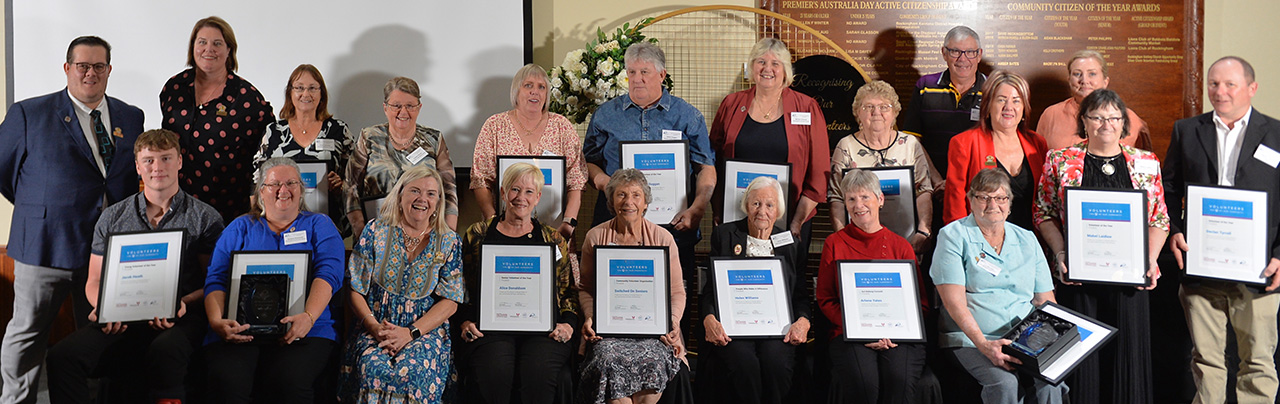 Volunteers in a group photos with their awards received at the recognition evening.