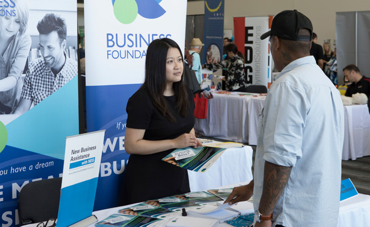 Man talking to Business Foundations at Jobs Expo stall