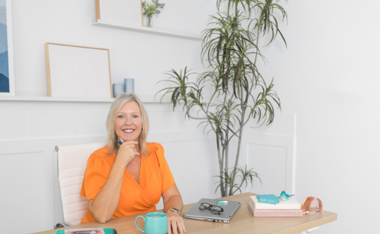 Alison Bannister sitting at a desk