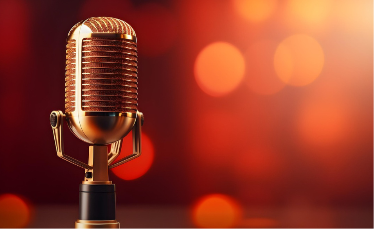 a microphone with orange stage lights