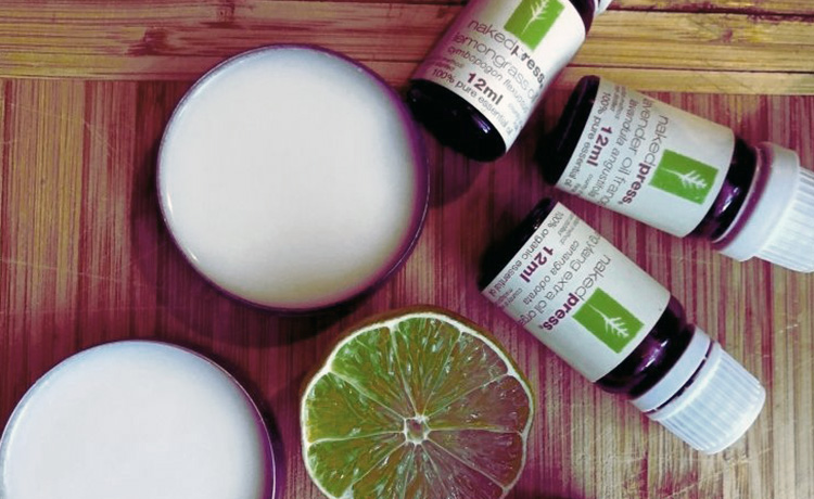 Two tubs of deodorant and bottles of essential oils