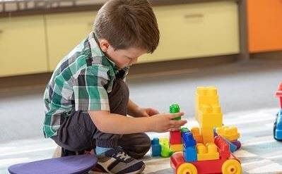 Child playing with building blocks Child playing with building blocks