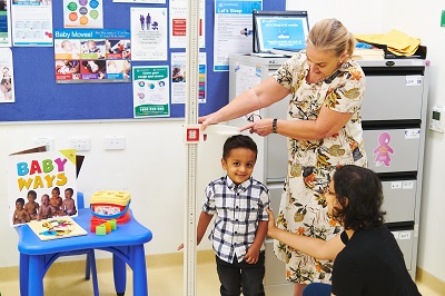 Getting height checked with child health nurse