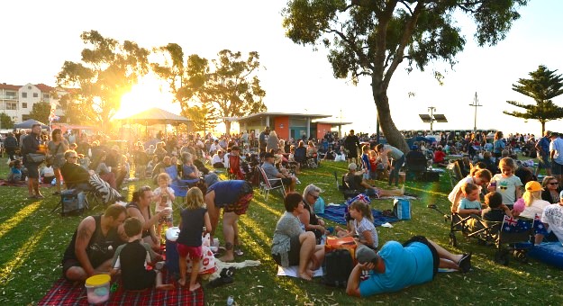 A large crowd of people enjoying an Australia Day picnic in Churchill Park