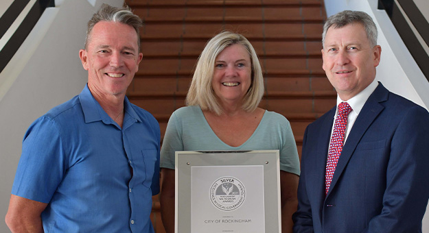 Toursim Manager Scott Jarvis, Mayor Deb Hamblin and CEO Michael Parker with the award.