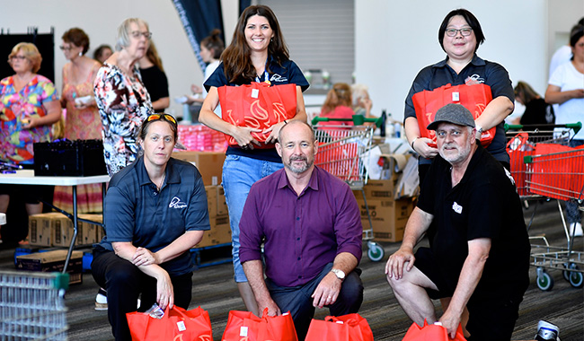City staff with the hampers they assisted in preparing.