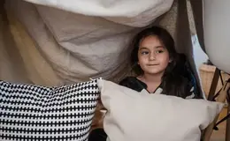 a girl in a tent
