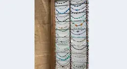 a group of colorful beads on a wall