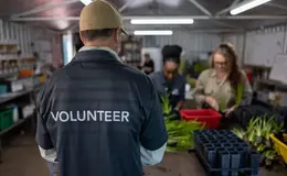 Man wearing a volunteer shirt