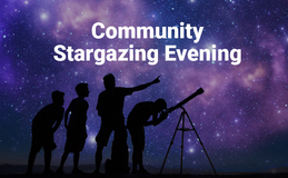 a group of people looking through a telescope