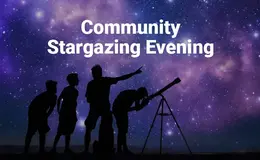 a group of people looking through a telescope
