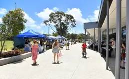 People walking around market stalls at Baldivis Sports Complex
