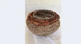 a woven basket with a hole
