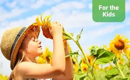a girl holding a sunflower
