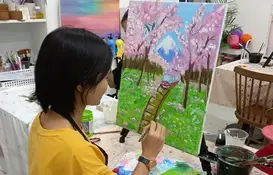 a woman painting a picture
