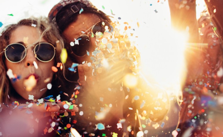 Girl in sunglasses with confetti