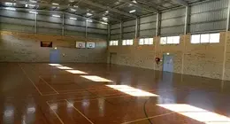 a large indoor gym with a basketball court