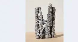 a rock sculpture on the ground