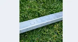 a metal bar on grass