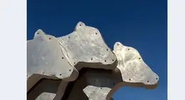 a metal sculpture of a bear