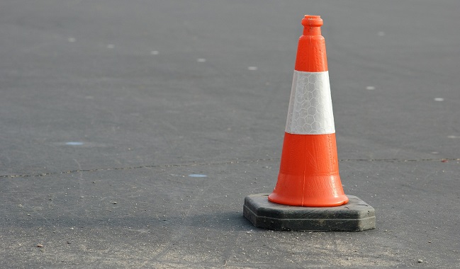 an orange and white traffic cone