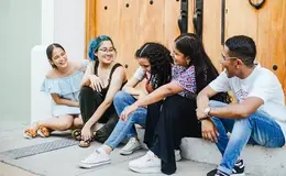 a group of people sitting on steps