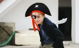 a boy in a pirate garment