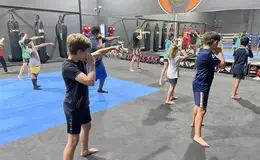 Group of young people with arms up MMA 