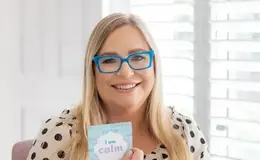 a woman holding a card