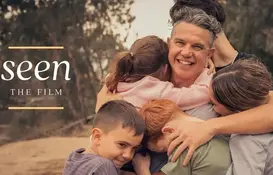 a group of people hugging each other