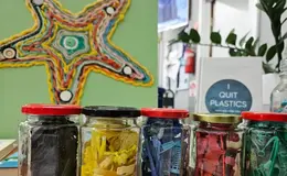 a group of glass jars with different objects in them