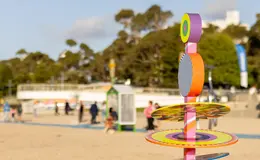 a colorful sculpture on a beach