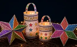 a group of paper lanterns with stars