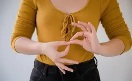 a person making a hand gesture