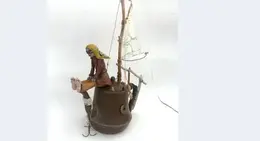 a statue of a pirate on a boat