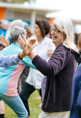 a group of people doing tai chi