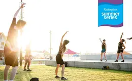 People doing dance fitness in the park