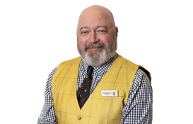 a man in a yellow vest