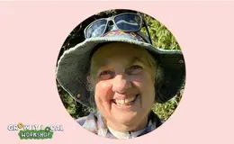 a woman wearing a hat and sunglasses