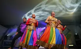 a group of people dancing on a stage