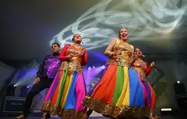 a group of people dancing on a stage