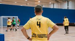 a man in a yellow shirt