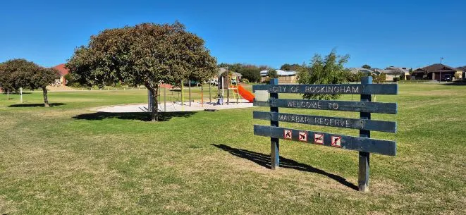 a sign in a park