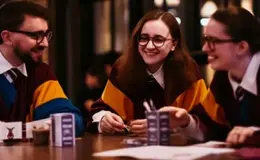 a group of people sitting at a table
