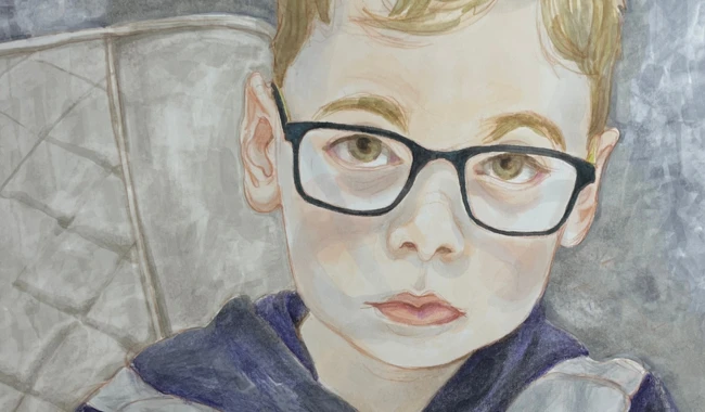 a boy wearing glasses