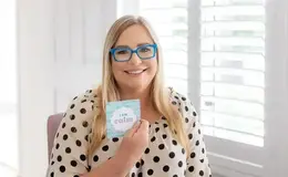 a woman holding a card