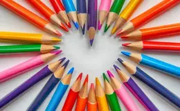 a heart made of colored pencils