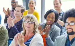 a group of people clapping
