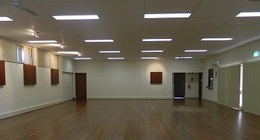 a room with a wood floor and a door