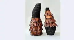 a pair of woven vases